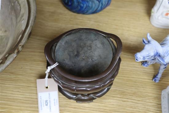 A Chinese bronze tripod censer and stand